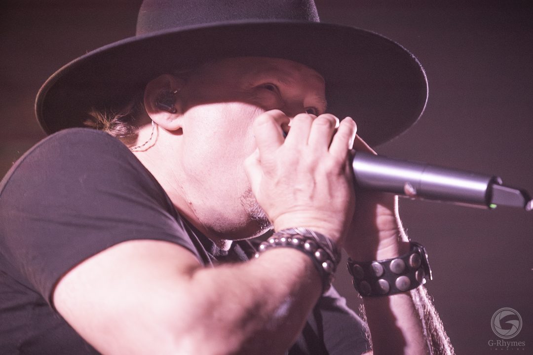 Harmonica solo under warm light, Midtown Ballroom, Bend